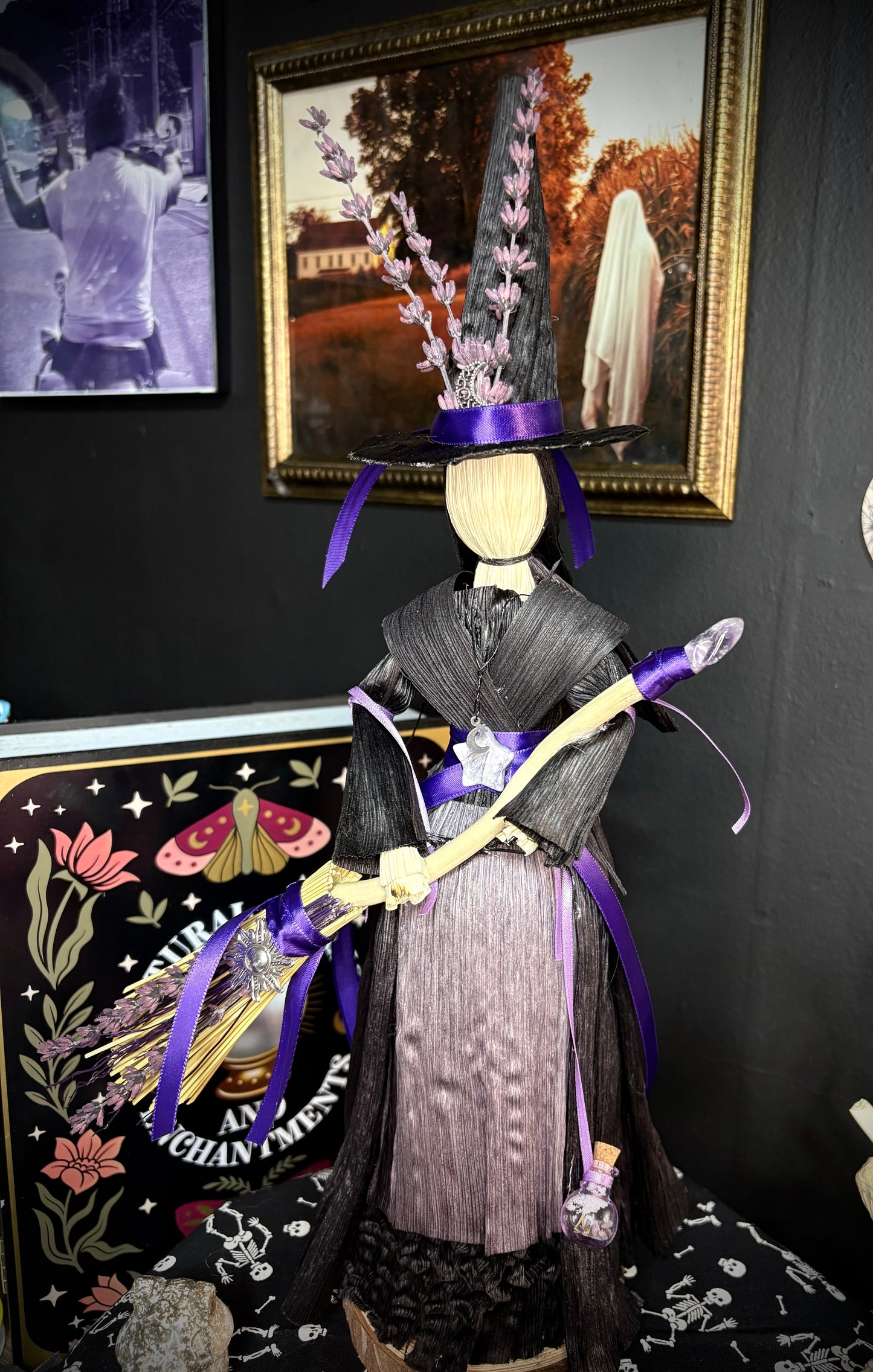 Purple corn husk doll with broom