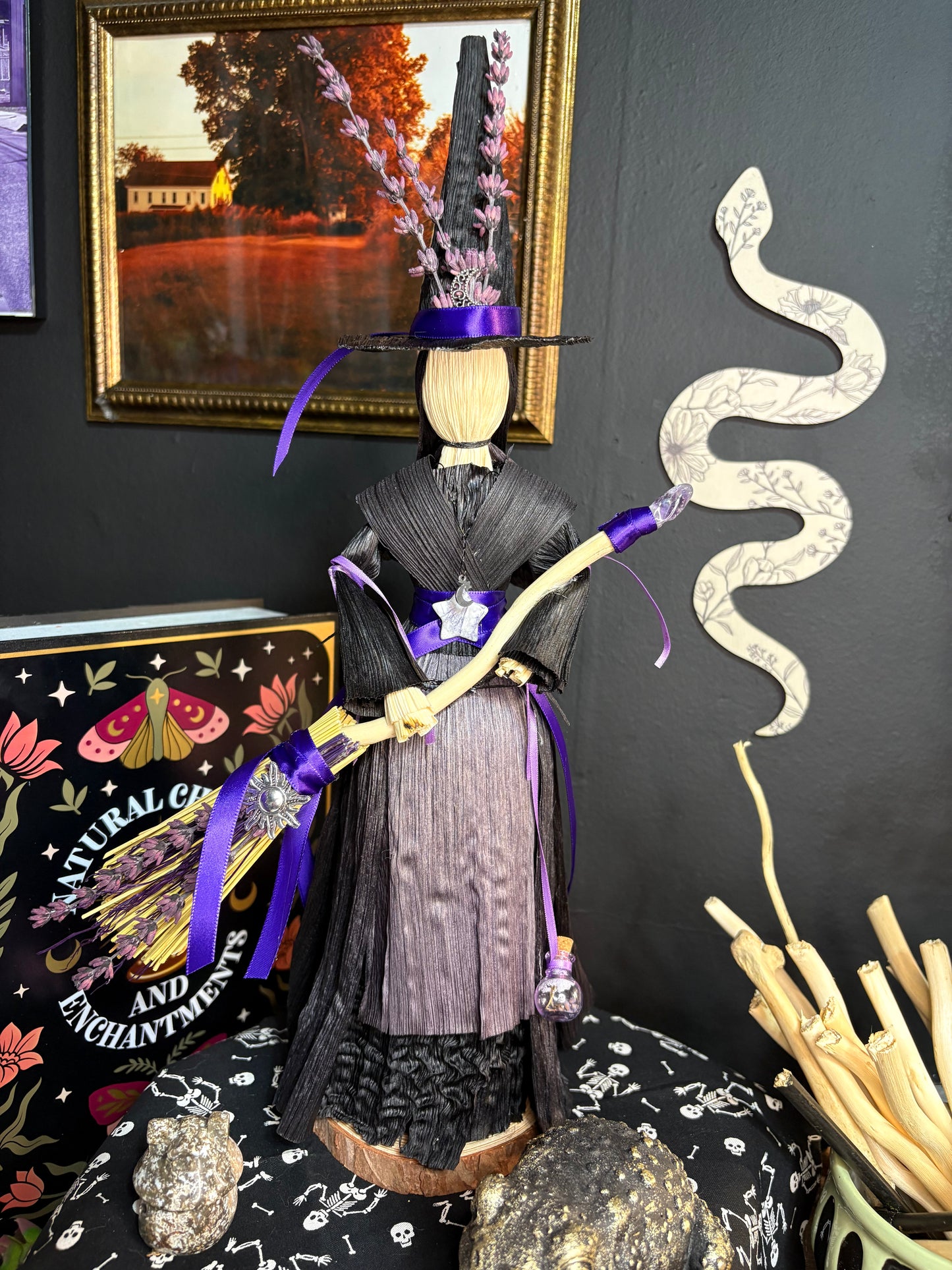 Purple corn husk doll with broom